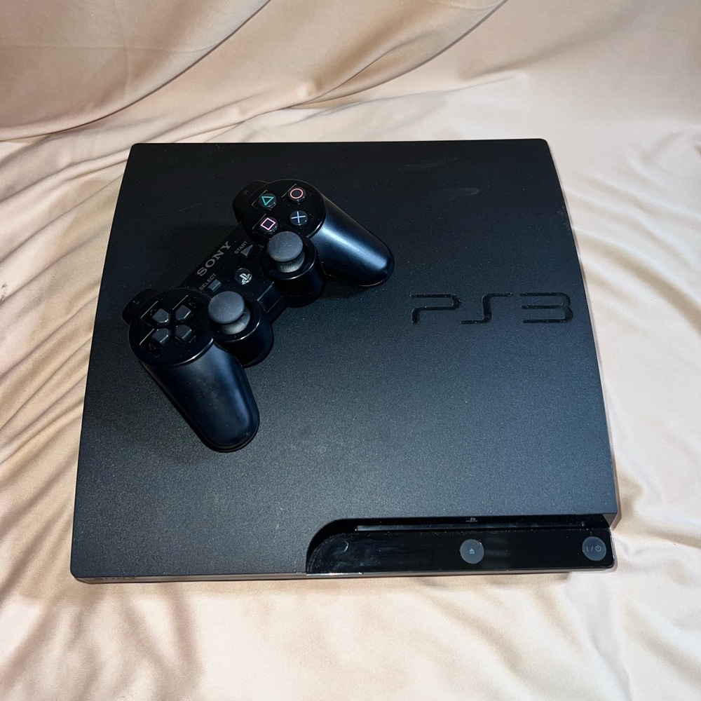 PlayStation 3 Slim for w/3 free games ! Great Condition!